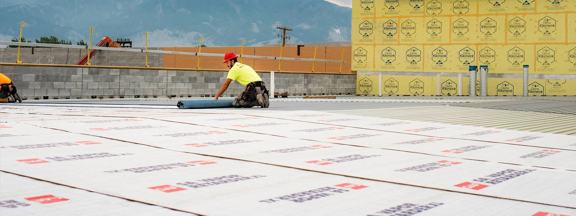 GAF certified contractors rolling out the new roof of Bozeman Public Safety Center in Montana