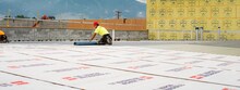 GAF certified contractors rolling out the new roof of Bozeman Public Safety Center in Montana